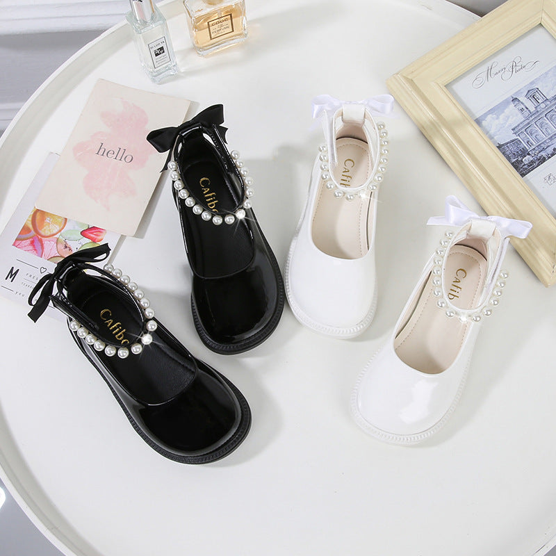 PEARL STRAP PATENT SHOES – CLASSIC CHARM WITH A TWIST