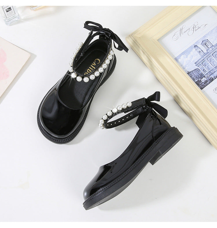 PEARL STRAP PATENT SHOES – CLASSIC CHARM WITH A TWIST