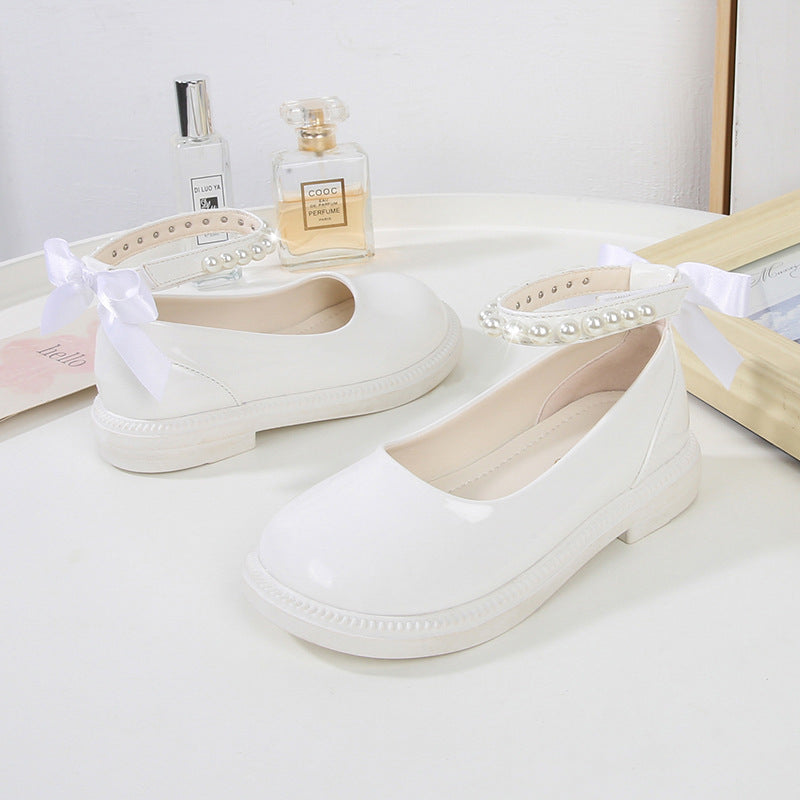 PEARL STRAP PATENT SHOES – CLASSIC CHARM WITH A TWIST