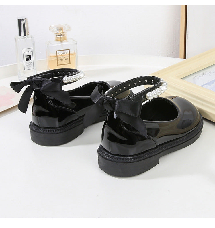 PEARL STRAP PATENT SHOES – CLASSIC CHARM WITH A TWIST